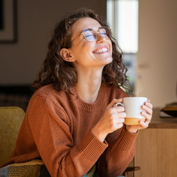 Portrait,Of,Joyful,Young,Woman,Enjoying,A,Cup,Of,Coffee